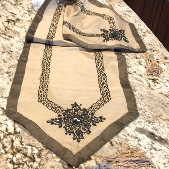 Table runner with embellishment. One small spot. 71” Tan with shimmer brown trim - Picture 1 of 4